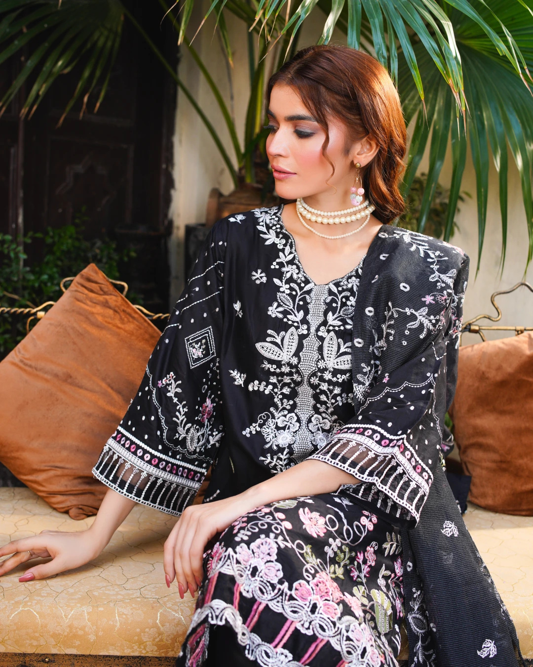 Black Embroidered Lawn Suit Multi-Color Thread Work - Model Sitting