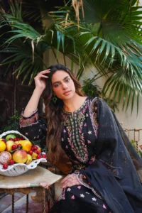 Aatiqa.com's Black Embroidered Lawn Unstitched 3-Piece Suit is a stunning choice for effortless elegance. This set features intricate floral embroidery on a premium lawn shirt, a plain trouser, and a matching dupatta, perfect for creating a custom-fit, sophisticated look.